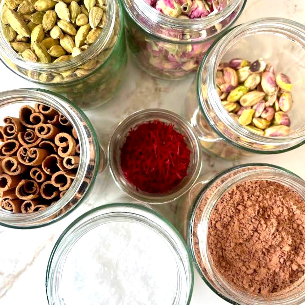 Jars of cardamom, dried rose, pistachio, cinnamon, saffron and cocoa at Caspian Coast Coffee