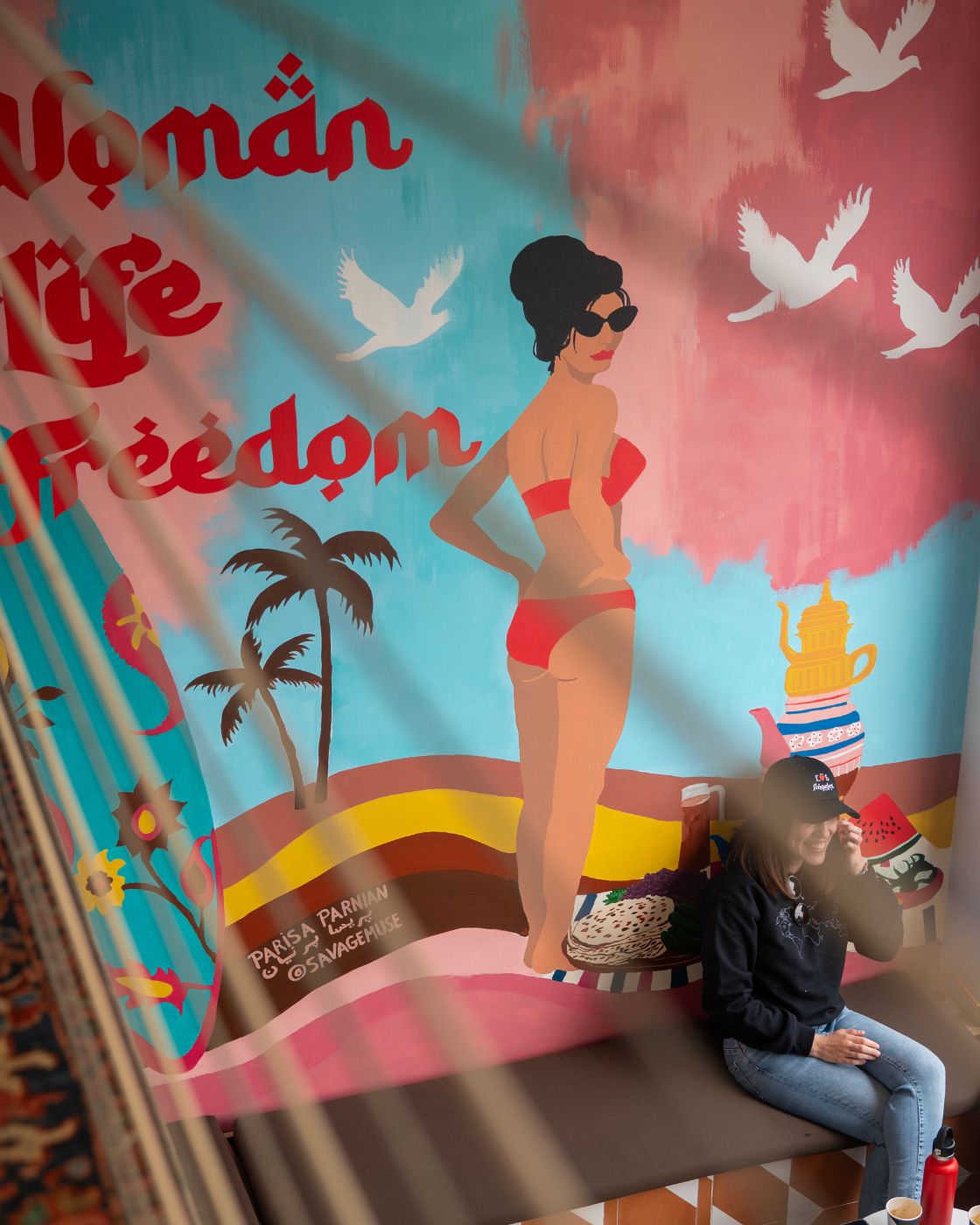 The Woman, Life, Freedom mural by Parisa Parnian inside Caspian Coast Coffee